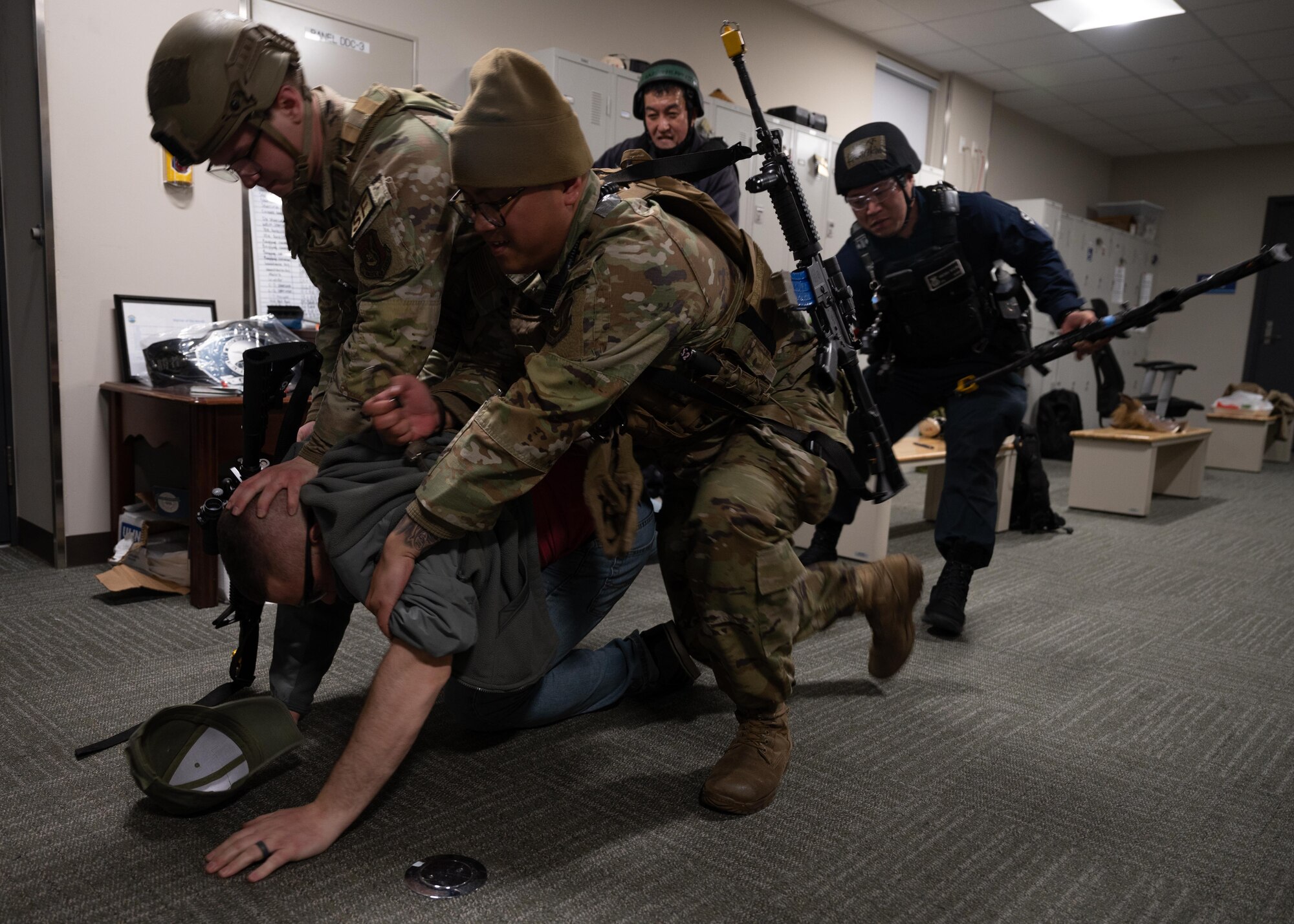 Security Forces detain a suspect