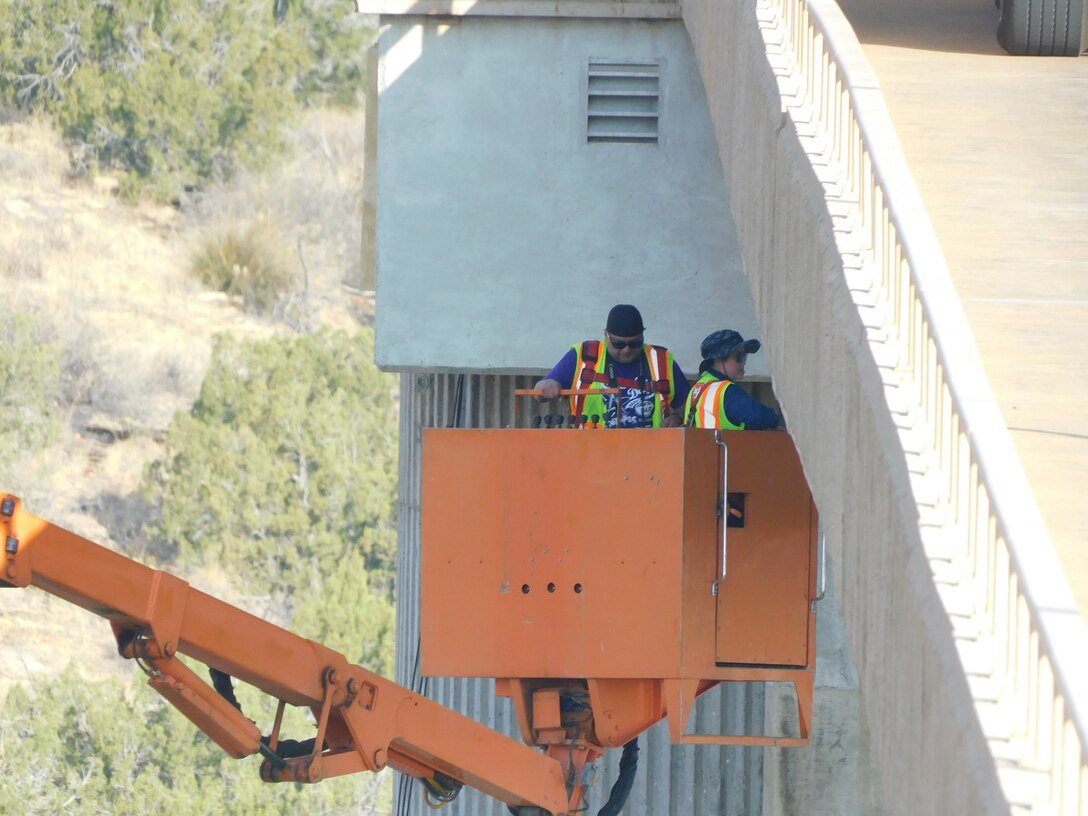 USACE-Albuquerque District employees inspect the bridge to the Santa Rosa Dam control tower using a contracted “Under-bridge Access Unit” during a routine 5-year periodic inspection, May 11, 2022. This crane, aka a “snooper crane,” was contracted from Duluth, Minnesota. Due to the very unique nature of the crane, there are only a few “rentable” vehicles of this type available in the U.S. and thus this contract action requires a long lead time.