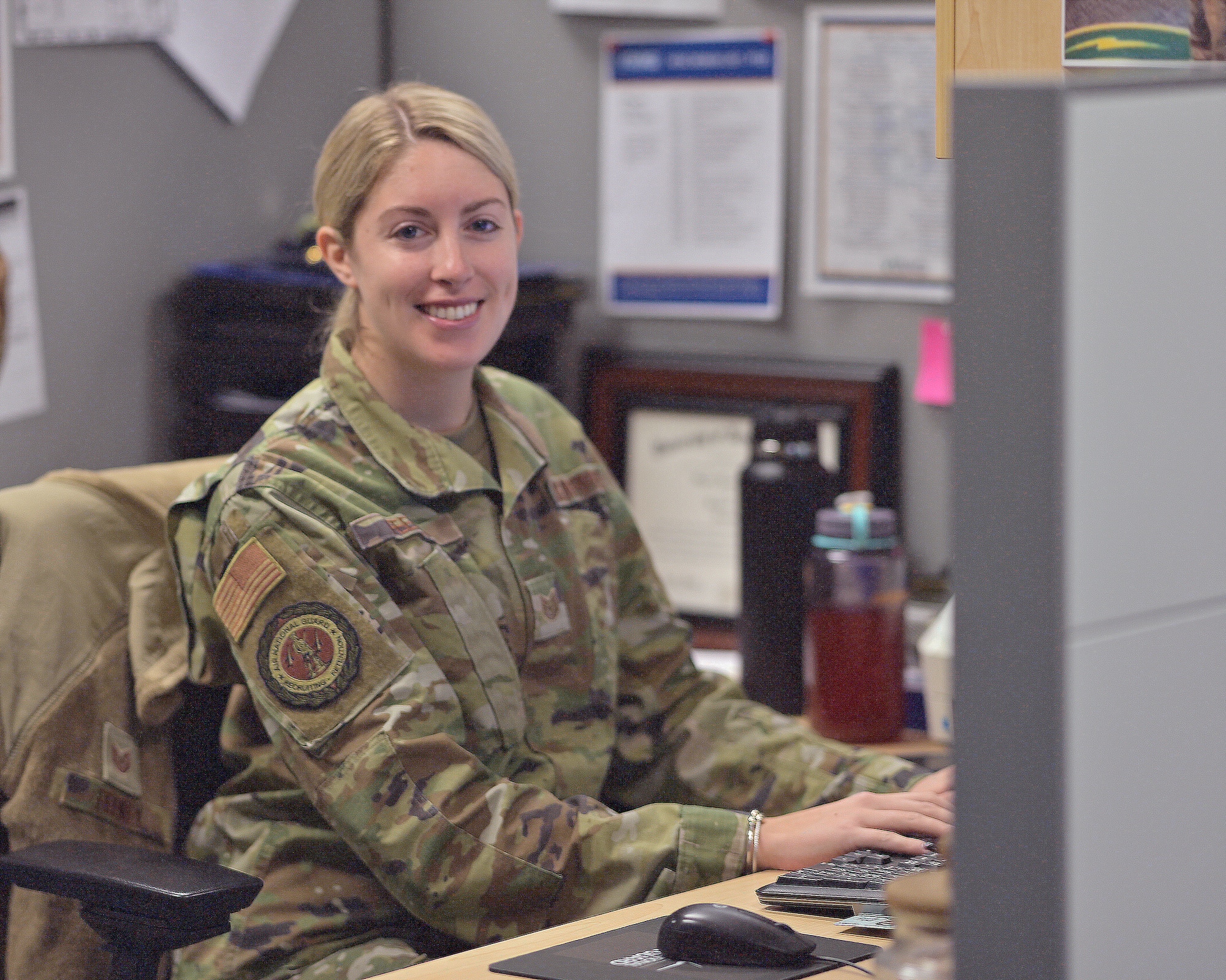 Photo of Tech. Sgt. Meghan Feeney, 158th Force Support Flight production recruiter for the Vermont Air National Guard, working in her office at the Vermont Air National Guard Base, South Burlington, Vermont, Dec. 30, 2022.