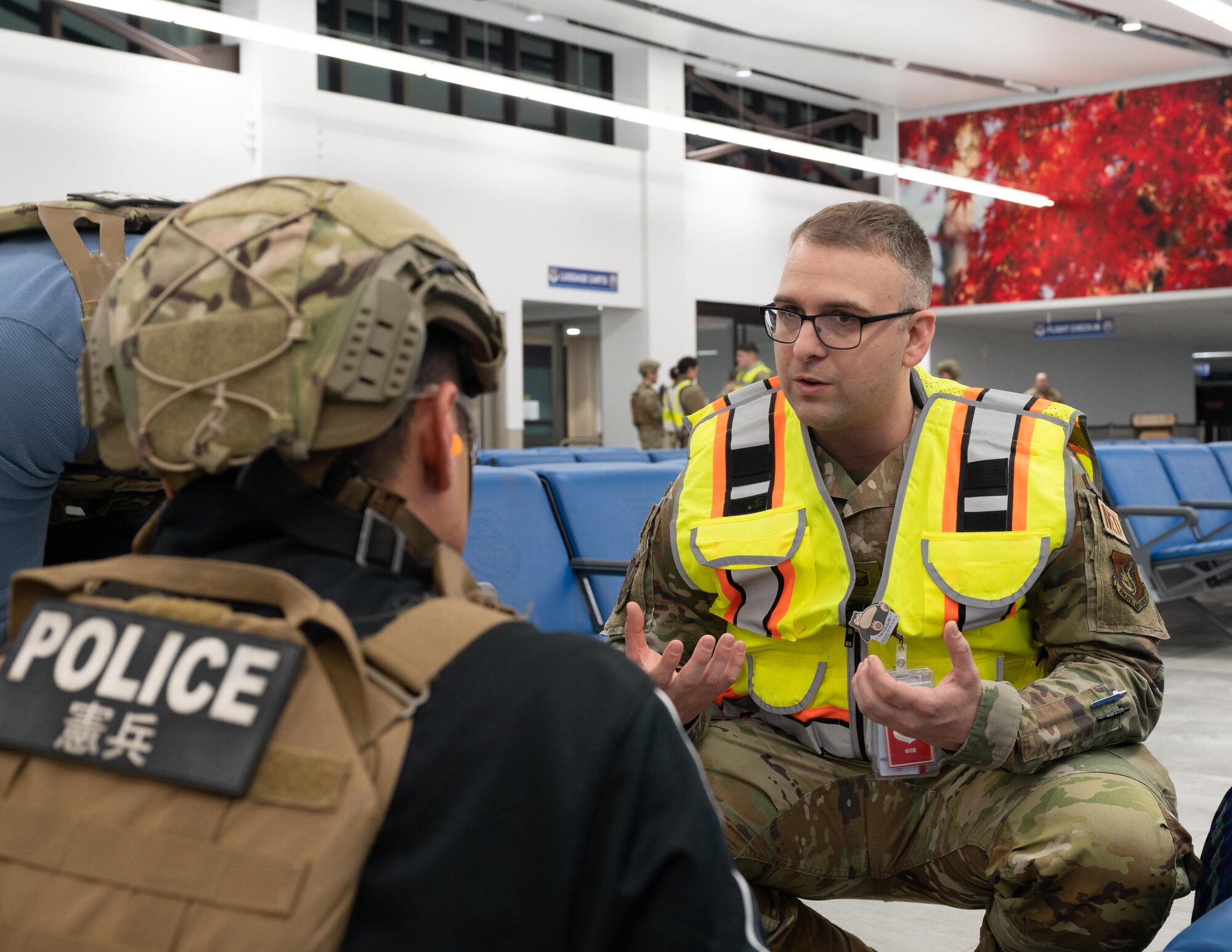 A Witness Inspection Team Member talks to first responders