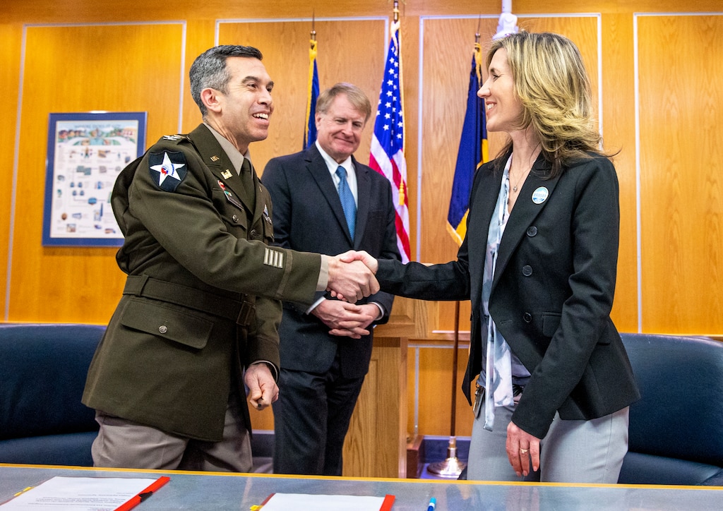 Ceremony signing for public partnership agreement.