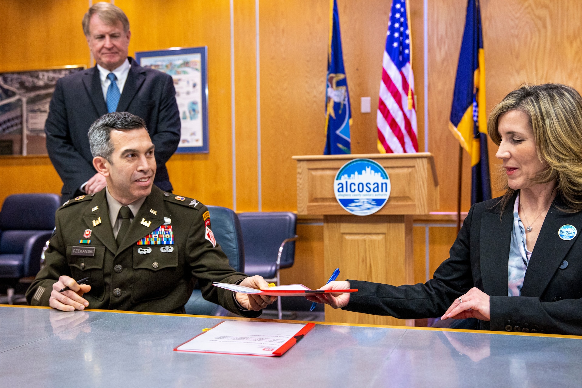 Ceremony signing for public partnership agreement.