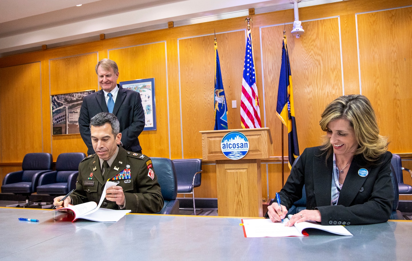 Ceremony signing for public partnership agreement.