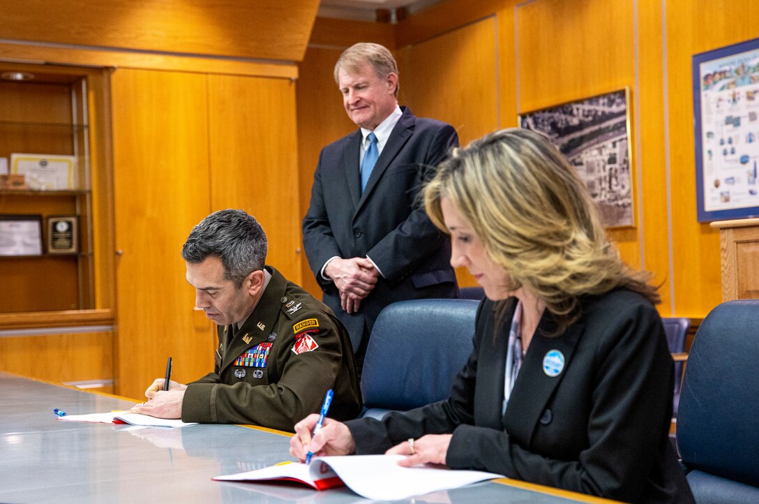 Ceremony signing for public partnership agreement.