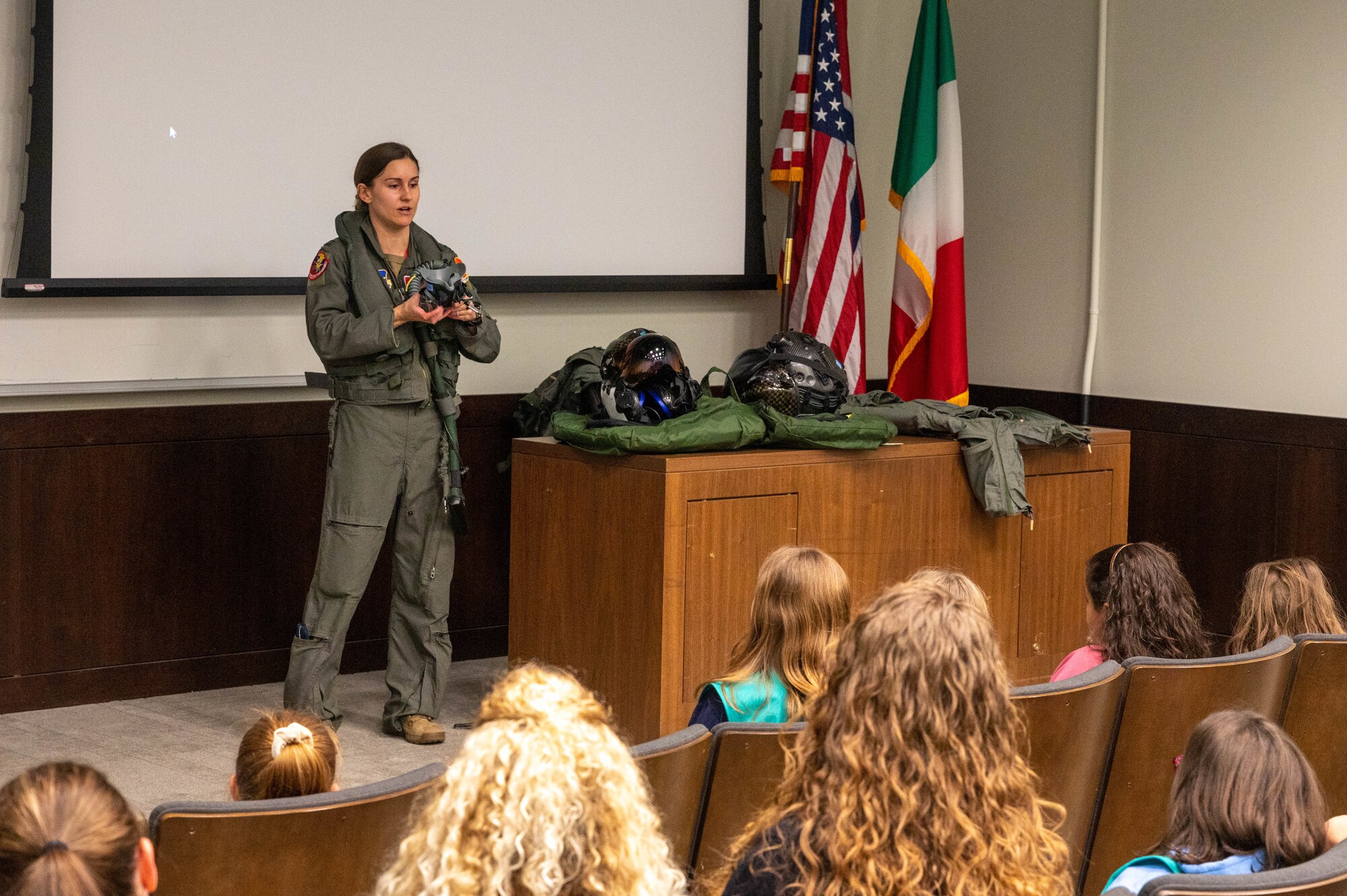 U.S. Air Force Capt. Melanie Kluesner, 62nd Fighter Squadron student pilot, shows various pieces of flight equipment to a local Girl Scouts troop Jan. 11, 2023, at Luke Air Force Base, Arizona.