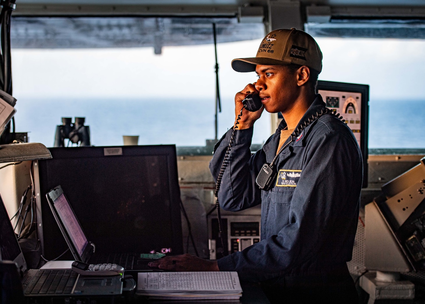 SOUTH CHINA SEA (Jan. 12, 2023) U.S. Navy Quartermaster 2nd Class Sebastian Nelson, from Miami, stands watch in the pilothouse of the aircraft carrier USS Nimitz (CVN 68). Nimitz is in U.S. 7th Fleet conducting routine operations. 7th Fleet is the U.S. Navy's largest forward-deployed numbered fleet, and routinely interacts and operates with Allies and partners in preserving a free and open Indo-Pacific region. (U.S. Navy photo by Mass Communication Specialist 3rd Class Hannah Kantner)