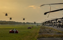 Four U.S. Army CH-47F Chinook helicopters from 1st Battalion, 214th Aviation Regiment (General Support Aviation Battalion), 12th Combat Aviation Brigade, prepare to land during exercise Falcon Autumn 22 at Vredepeel, Netherlands, Nov. 5, 2022. 12 CAB is among other units assigned to V Corps, America's Forward Deployed Corps in Europe. They work alongside NATO Allies and regional security partners to provide combat-ready forces, execute joint and multinational training exercises, and retain command and control for all rotational and assigned units in the European Theater. (U.S. Army photo by Staff Sgt. Thomas Mort)