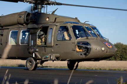 A U.S. Army UH-60 Black Hawk helicopter from 1-214th General Support Aviation Battalion,12th Combat Aviation Brigade, taxis along the flight line after refueling during exercise Falcon Autumn 22 at Vredepeel, Netherlands, Nov. 5, 2022. 12 CAB is among other units assigned to V Corps, America's Forward Deployed Corps in Europe. They work alongside NATO Allies and regional security partners to provide combat-ready forces, execute joint and multinational training exercises, and retain command and control for all rotational and assigned units in the European Theater. (U.S. Army photo by Staff Sgt. Thomas Mort)