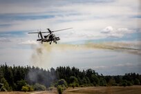 An AH-64D Apache Longbow Helicopter assigned to the 1st Battalion, 3rd Aviation Regiment (Attack Reconnaissance), 12th Combat Aviation Brigade, displays the aircraft's weapons capabilities during the Viper Battalion family day event at Grafenwoehr Training Area, Germany, August 6, 2022. (U.S. Army photo by Staff Sgt. Preston Malizia)