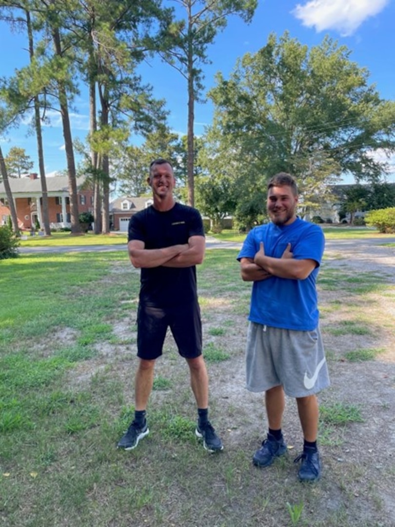 Master Chief Petty Officer Aaron Turbett and then-recruit Jackson Midgett get ready for a running workout at the Coast Guard base in Elizabeth City, North Carolina in August 2022. Midgett spent eight weeks training with Turbett to meet boot camp fitness standards.