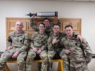 Staff Sgt. Elizabeth Cox, second from left, an armored crewman with the Texas Army National Guard’s 3rd Squadron, 278th Armored Cavalry Regiment, poses with fellow graduates at the Army National Guard Warrior Training Center at Fort Benning, Ga. Cox recently became the first female in the ARNG to graduate from the Abrams Master Gunner school, an advanced gunnery and maintenance school that earns graduates the designation of Abrams Master Gunner.