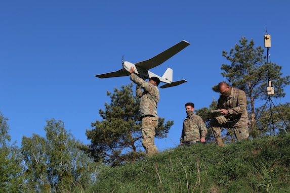 U.S. Army Sgt. Juan Gonzalez, an infantryman assigned to 3rd Squadron, 2nd Cavalry Regiment, launches a Puma unmanned aerial vehicle during a live-fire exercise at Bemowo Piskie Training Area, Poland, June 2, 2020. The Soldiers are deployed in support of NATO's enhanced Forward Presence Battle Group-Poland. NATO’s enhanced Forward Presence consists of four battalion-sized battle groups deploying on a persistent rotational basis to Estonia, Latvia, Lithuania and Poland to demonstrate the alliance’s determination and ability to act as one in response to any aggression against its members. (U.S. Army photo by Spc. Justin W. Stafford)