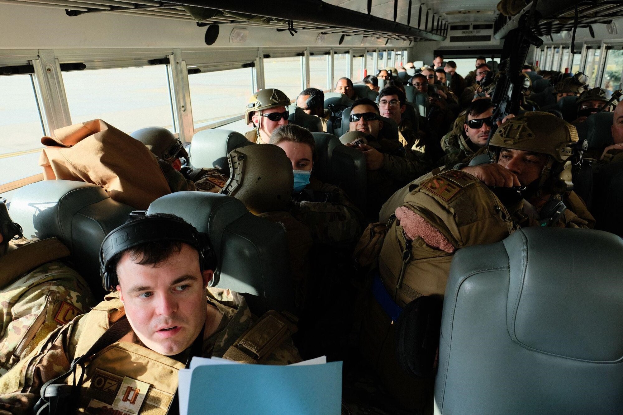 U.S. Air Force Airmen assigned to the 621st Contingency Response Wing are transported by the 305th Aerial Port Squadron through McGuire Field as part of exercise Jersey Devil at Joint Base McGuire-Dix-Lakehurst, N.J., Jan. 11, 2023. Jersey Devil 23, a U.S. Air Force mobility exercise hosted by the 621st CRW, tests the abilities of multi-capable airmen to rapidly deploy, establish and control airbases alongside joint allies and partners. (U.S. Air Force photo by Senior Airman Joseph Morales)