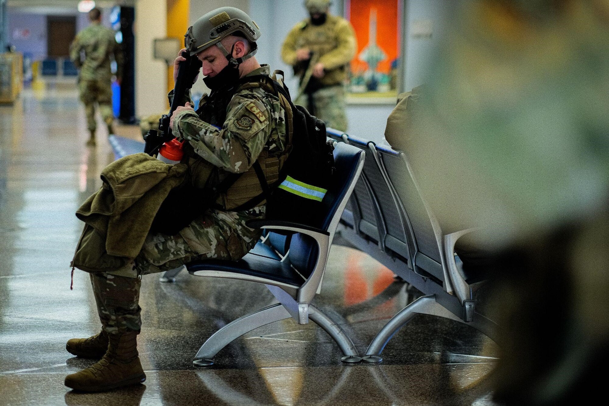 A U.S. Air Force service member assigned to the 621st Contingency Response Wing takes pause after checking in the passenger terminal as part of exercise Jersey Devil at Joint Base McGuire-Dix-Lakehurst, N.J., Jan. 11, 2023. Jersey Devil 23, a U.S. Air Force mobility exercise hosted by the 621st CRW, tests the abilities of multi-capable airmen to rapidly deploy, establish and control airbases alongside joint allies and partners. (U.S. Air Force photo by Senior Airman Joseph Morales)