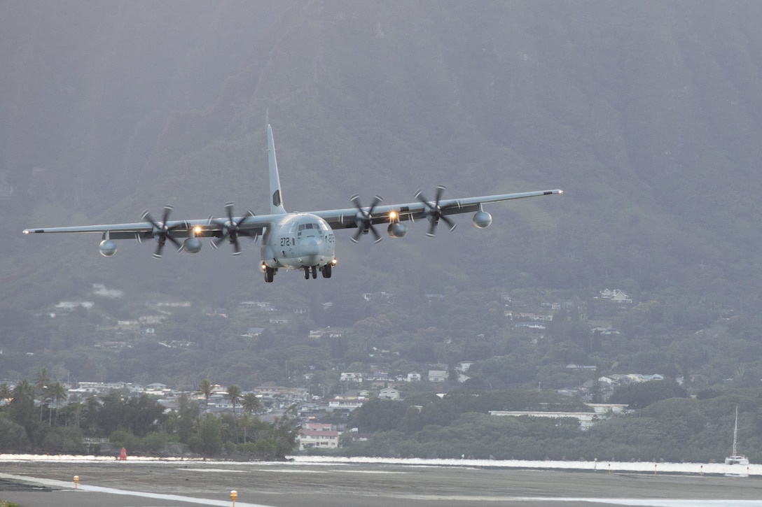 A U.S. Marine Corps KC-130J aircraft assigned to Marine Aerial Refueler Transport Squadron 153 prepares to land on Marine Corps Air Station Kaneohe Bay, Marine Corps Base Hawaii, Jan. 6, 2023. Jan. 6, 2023. VMGR-153 will formally activate as a KC-130 squadron of Marine Aircraft Group 24, 1st Marine Aircraft Wing, on Jan. 13, 2023. (U.S. Marine Corps photo by Cpl. Chandler Stacy)