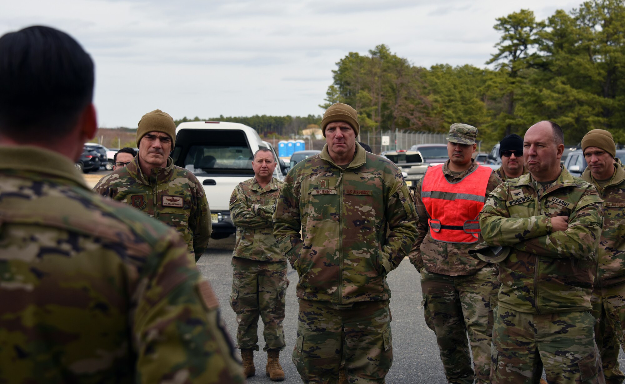 U.S. Air Force Col. William Gutermuth, 514th Air Mobility Wing commander, U.S. Air Force Chief Master Sgt. Len Werner, 514th AMW command chief, and U.S. Army Col. Mitchell Wisniewski III, Joint Base McGuire-Dix-Lakehurst deputy commander join exercise participants to listen to Jersey Devil 23 exercise briefings.