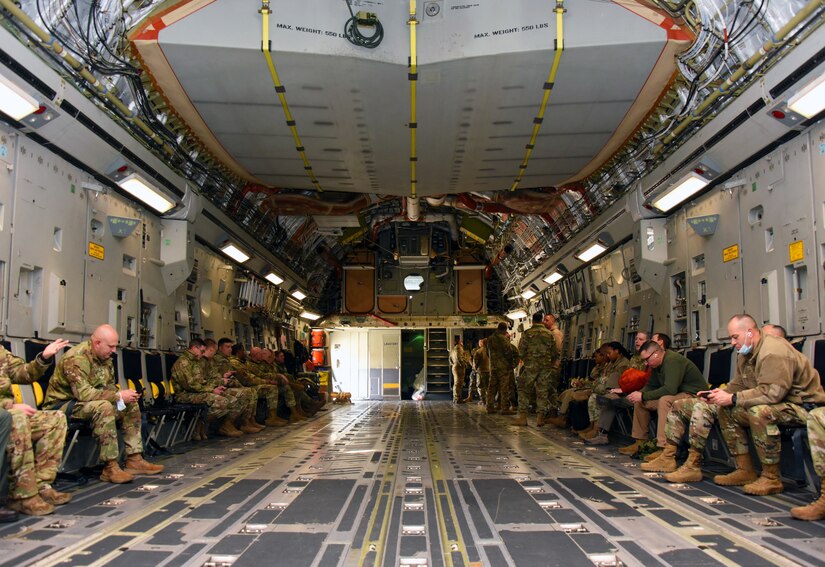 Jersey Devil 23 exercise participants await takeoff inside the C-17 Globemaster III.
