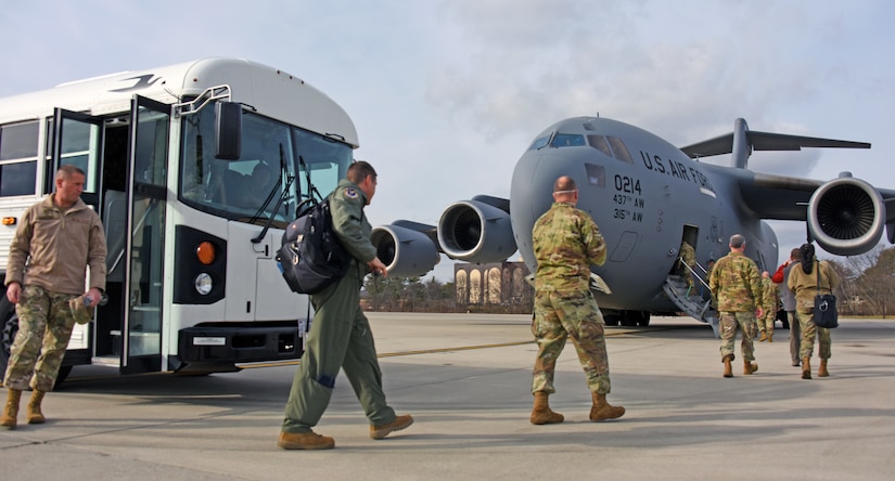 Exercise participants arrive to board a C-17 Globemaster III on Joint Base McGuire-Dix-Lakehurst, N.J.