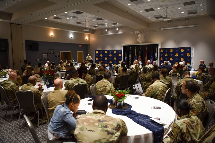 Goodfellow members listen to Col. Matthew Reilman, 17th Training Wing Commander as he speaks during the MLK observance day event on Goodfellow Air Force Base, Texas, 13 Jan., 2023. Reilman highlighted the strength our diverse force offers to our warfighting efforts, keeping us ahead of our competitors. (U.S. Air Force Photo by Staff Sgt. Tyrell Hall)