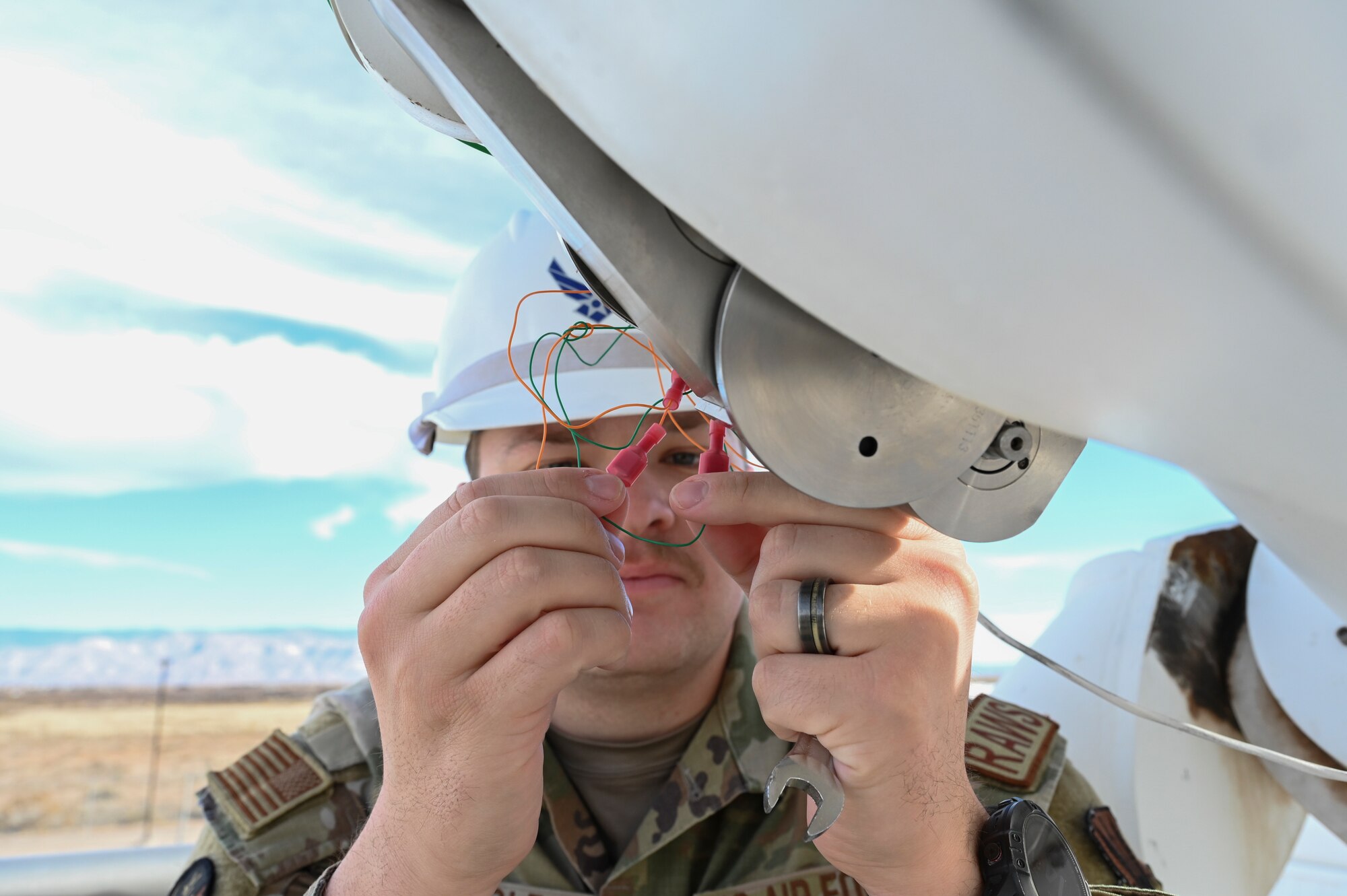 U.S. Air Force Staff Sgt. Colin Bauerle, 2nd Weather Squadron radar airfield and weather systems technician, performs maintenance on the observatory telescope at Holloman Air Force Base, New Mexico, Jan. 6, 2023. The telescope tracks and monitors any solar activity that can cause radio or electrical interferences to the Air Forces mission. (U.S. Air Force photo by Airman 1st Class Isaiah Pedrazzini)