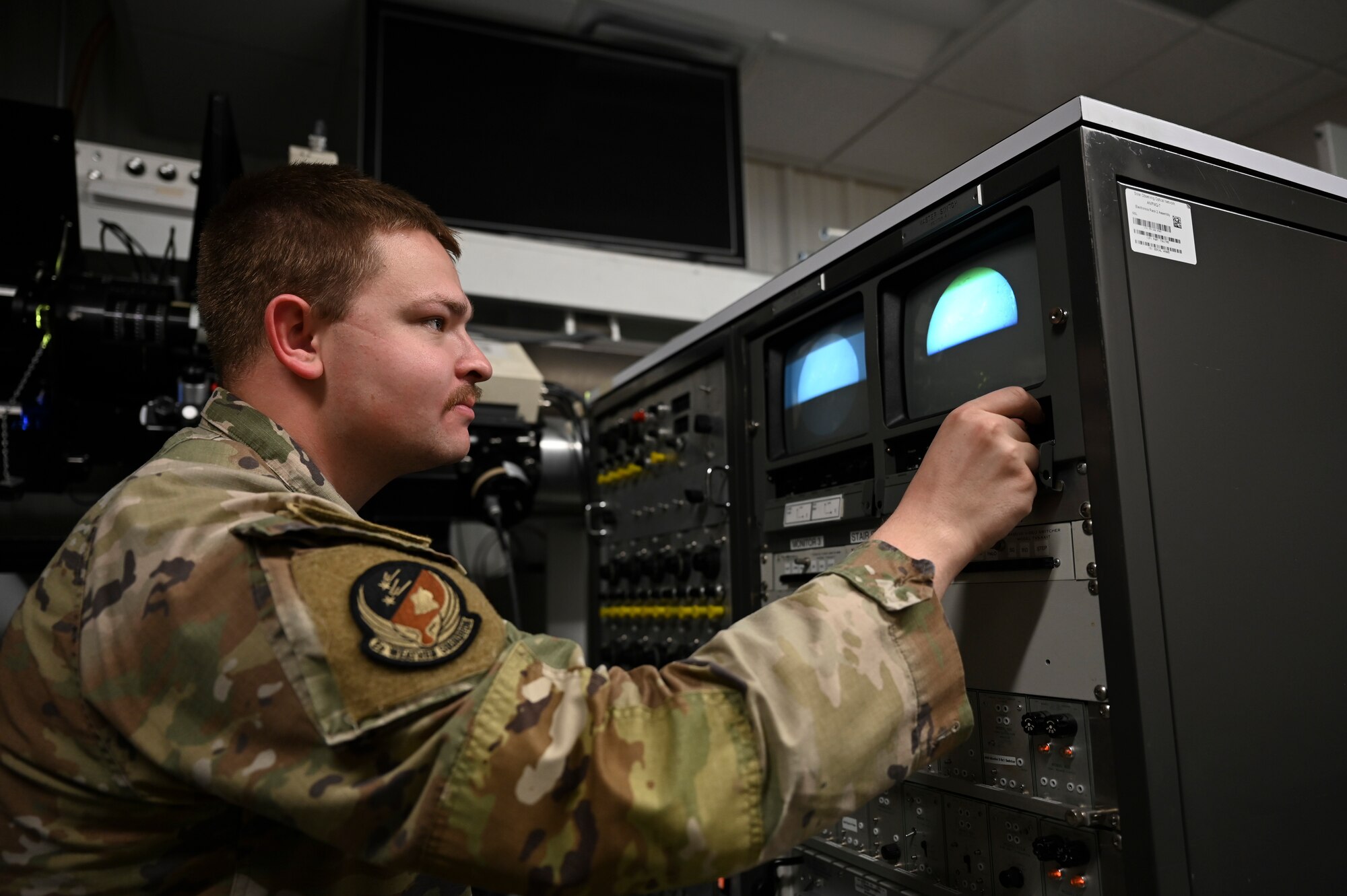 U.S. Air Force Staff Sgt. Colin Bauerle, 2nd Weather Squadron radar airfield and weather systems technician, examines a monitor of the sun at Holloman Air Force Base, New Mexico, Jan. 6, 2023. The primary mission for the 2nd WS is to alert both Holloman and the Air Force of any solar activity that is capable of disrupting both electrical and radio signals. (U.S. Air Force photo by Airman 1st Class Isaiah Pedrazzini)