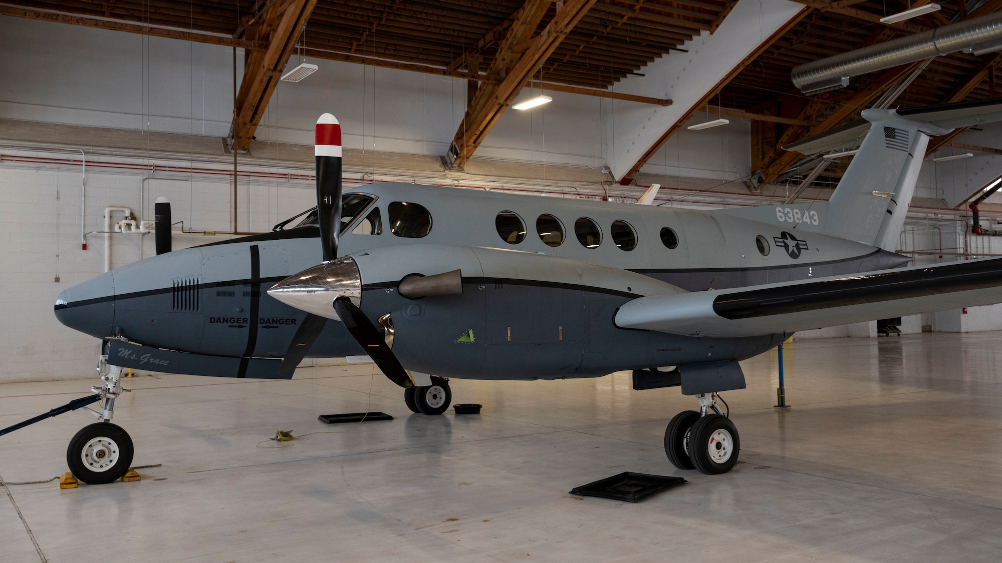 A C-12F Huron assigned to the 586th Flight Test Squadron parked in a hangar at Holloman Air Force Base, New Mexico, Jan. 10, 2022.