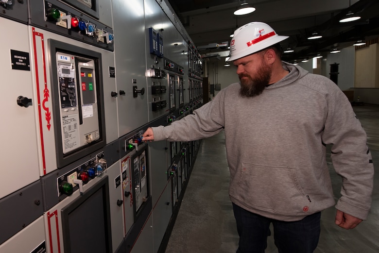 James Riley, Powerplant senior operator at Wolf Creek Dam on the Cumberland River in Jamestown, Kentucky, turns a switch inside the hydropower plant Jan. 10, 2023. He supervises and operates hydropower and spillway gate equipment in support of the flood risk management mission at the project. (USACE Photo by Lee Roberts)
