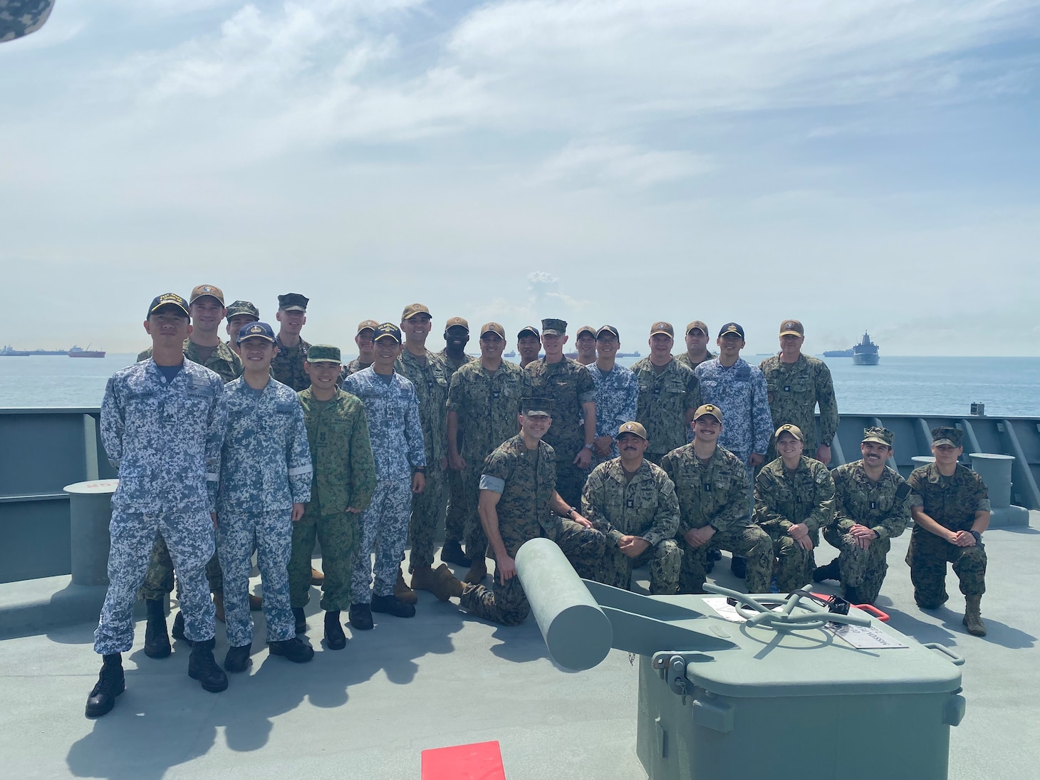 Commanders and leaders from Destroyer Squadron 7, the Makin Island Amphibious Ready Group, 13th Marine Expeditionary Unit, and the Republic of Singapore Navy pose for a photo aboard RSS Endurance (207) during Cooperation Afloat Readiness and Training/Marine Exercise Singapore in the waters off Singapore, Jan. 12. CARAT/MAREX Singapore is a bilateral exercise between Singapore and the United States designed to promote regional security cooperation, maintain and strengthen maritime partnerships, and enhance maritime cooperation. In its 28th year, the CARAT series is comprised of multinational exercises, designed to enhance U.S. and partner navies’ abilities to operate together in response to traditional and non-traditional maritime security challenges in the Indo-Pacific region.