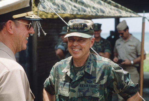Lieutenant General Charles J. Cunningham, Jr., commander, 12th Air Force, Tactical Air Command, speaks with Rear Admiral Ted C. Steel, Jr., commander, U.S. Forces, Caribbean, during closing ceremony held for exercise Solid Shield, in Honduras, in 1987 (U.S. Air Force/Kit Thompson)