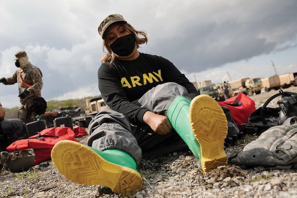 Chemical, biological, radiological, and nuclear specialist with 140th Chemical Company, California Army National Guard, dresses in MOPP 4 protective gear at site of notional nuclear attack on Charlestown, South Carolina, April 21, 2021 (U.S. Army Reserve/Darianne Hudson)