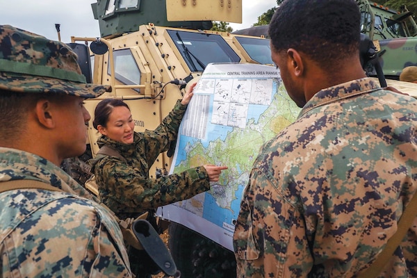 Marine Corps 1st Lieutenant Kristen Dang, platoon commander with Combat Logistics Company Alpha, Combat Logistics Battalion 3, Combat Logistics Regiment 3, discusses plan during Jungle Warfare Exercise 22, at Landing Zone Dodo, Okinawa, Japan, February 16, 2022 (U.S. Marine Corps/Federico Marquez)