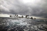 Coast Guardsmen and Sailors participate in noncompliant vessel pursuit tactics exercise