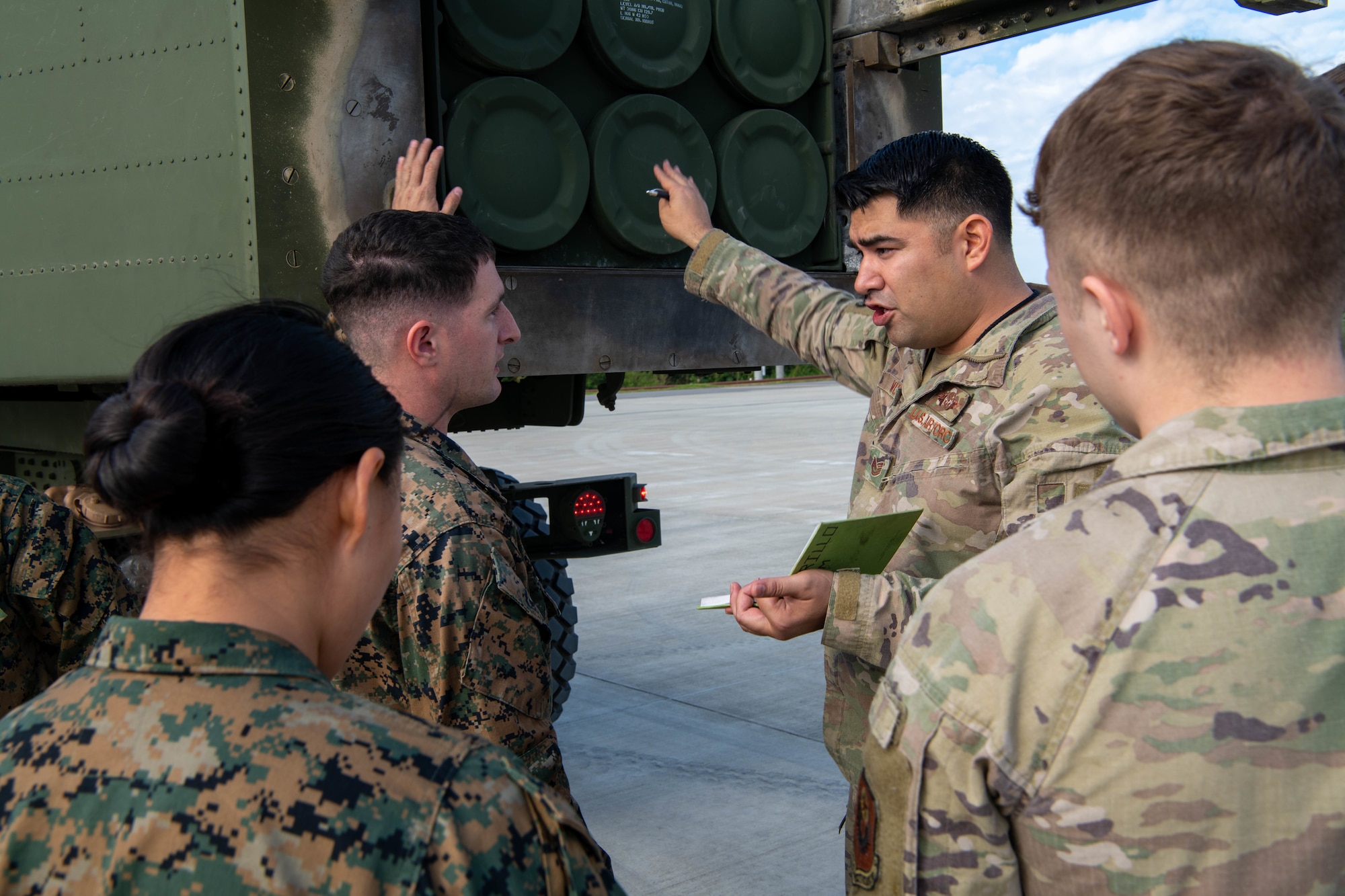 Airmen and Marines discuss ideas.