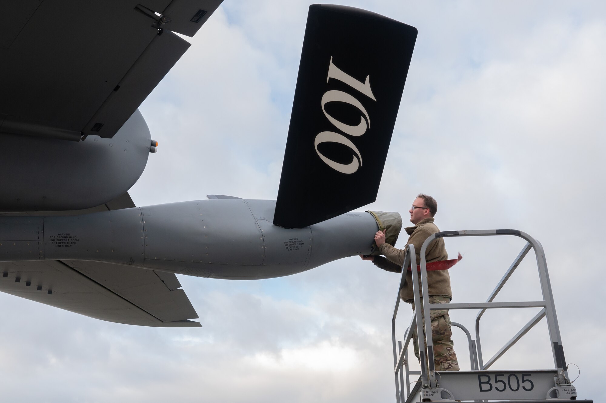 U.S. Air Force Staff Sgt. Guy Mobley, 100th Aircraft Maintenance Squadron aerospace propulsion craftsman, places the boom cover on a KC-135 Stratotanker aircraft after an idle engine run procedure on the flightline, Jan. 9, 2023, at Royal Air Force Mildenhall, England.
