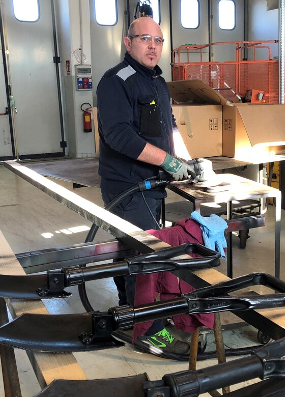 Emanuele Cecchetto is a machinist and welder with Logistics Readiness Center Italy’s Installation Material Maintenance Activity. He was recently selected as LRC Italy’s Employee of the Quarter, junior-grade category, 1st Quarter, FY 2023. Pictured here, Cecchetto refurbishes entrenching tools at his workplace. (U.S. Army courtesy photo)