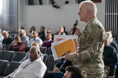 Defense Logistics Agency Energy Chief of Staff Air Force Col. Keith Mecham talks in a microphone