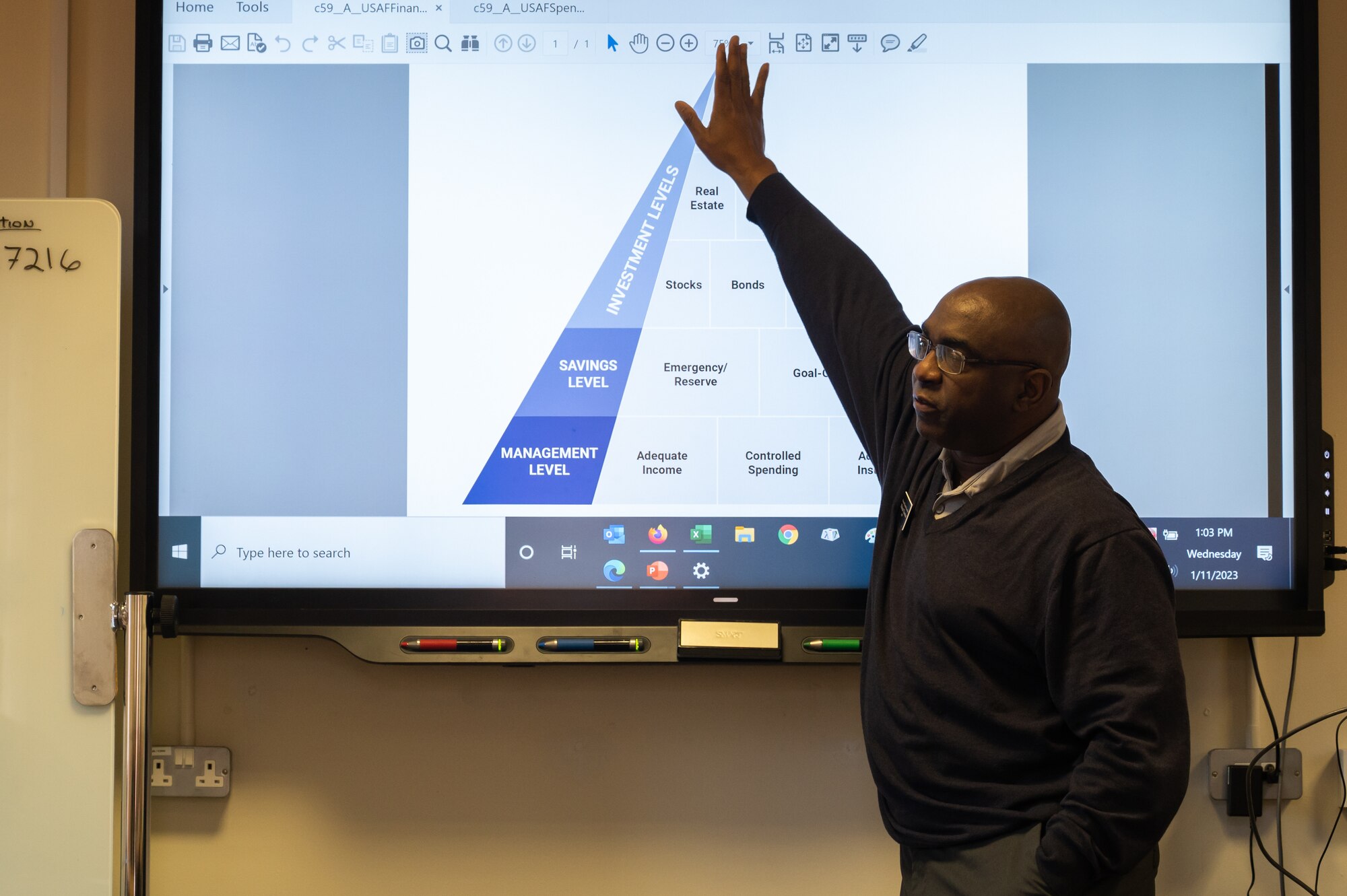 Michael Chatman, Military and Family Readiness Center personal financial counselor, instructs Team Mildenhall Airmen about financial responsibility and money management, Jan. 11, 2023, at Royal Air Force Mildenhall, England.
