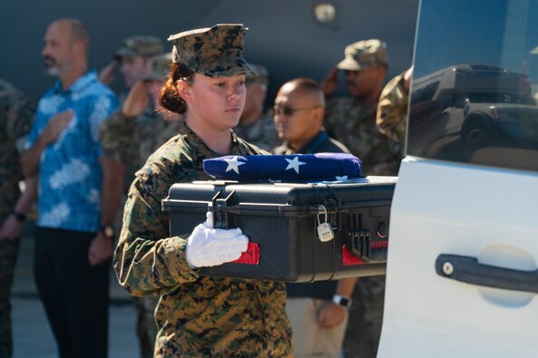 Members of the Defense POW/MIA Accounting Agency (DPAA) perform a repatriation ceremony in honor of the recovered remains of military personnel at Joint Base Pearl Harbor Hickam, Hawaii, Dec. 17, 2022. The remains of these unknown personnel recovered from various regions in Solomon Islands will undergo an examination for possible identification at DPAA. (U.S. Army photo by Sgt. Edward Randolph/DPAA)