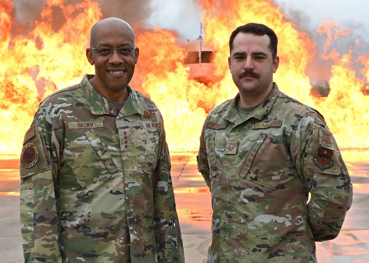 Air Force Chief of Staff Gen. CQ Brown, Jr. and Master Sgt. Matthew Broussard, 312th Training Squadron fire apprentice course chief, pose for a photo at Goodfellow Air Force Base, Texas, Dec. 12, 2022. During a visit to the base, Brown witnessed how the 312th TRS is advancing fire training for both Air Force and area firefighters. (U.S. Air Force photo by Airman 1st Class Zachary Heimbuch)