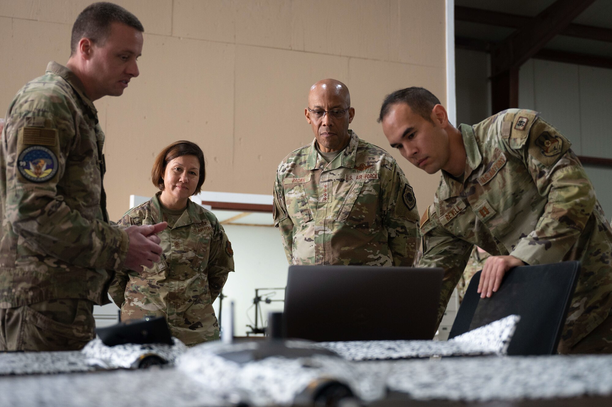 U.S. Air Force Chief of Staff Gen. CQ Brown, Jr., and Chief Master Sergeant of the Air Force JoAnne S. Bass, participate in a demonstration with Task Force 99 Airmen at Al Udeid Air Base, Qatar, Jan. 9, 2023. During their visit, Chief Bass and Gen. Brown met with AUAB leadership and Airmen, toured the Task Force 99 facility and hosted an all call. Task Force 99 is a specialized unit charged with rapidly innovating and enhancing Ninth Air Force (Air Forces Central) capabilities to ensure the successful implementation of Gen. Brown’s priority to accelerate change across the Air Force. (U.S. Air Force photo by Airman 1st Class Andrew Britten)