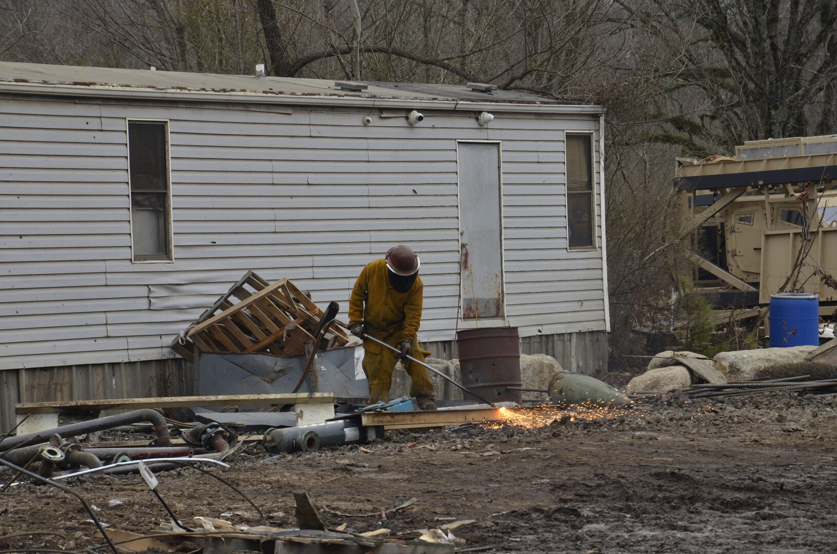 man torching scrap