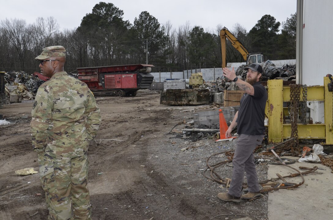 two men in scrap yard