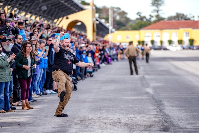 Guests of Lima Company, 3rd Recruit Training Battalion cheer on the newest Marines at Marine Corps Recruit Depot San Diego, Jan. 12, 2023