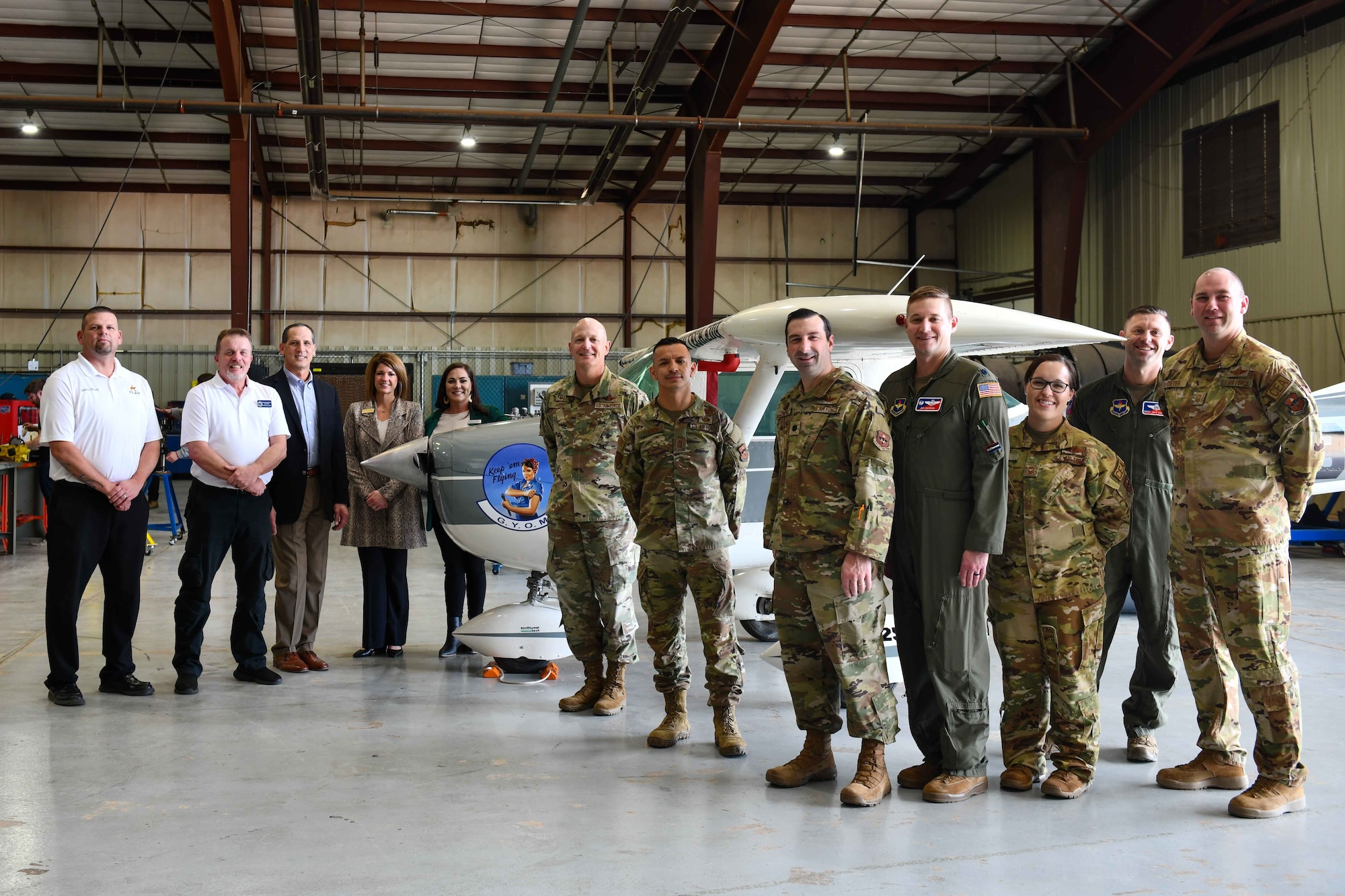 Altus Air Force Base (AAFB) personnel pose with leaders from Southwest Technology Center in Altus, Oklahoma, Jan. 11, 2023. The partnership between the trade school and AAFB continues to transform the way Airmen and service members learn and train in mobility’s hometown. (U.S.Air Force photo by Airman 1st Class Kari Degraffenreed)