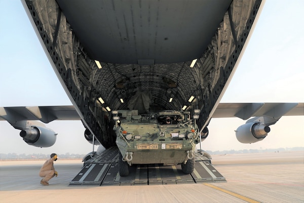 Army Stryker infantry carrier vehicle rolls off C-17 cargo plane in India, February 1, 2021, in preparation for Yudh Abhyas, bilateral military exercise involving approximately 500 soldiers from Indian and U.S. armies (U.S. Army/Joseph Tolliver)