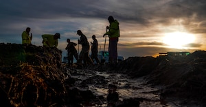 U.S. Air Force 9th Civil Engineer Squadron Airmen unblock a culvert Jan. 12, 2022, at Beale Air Force Base, Calif.