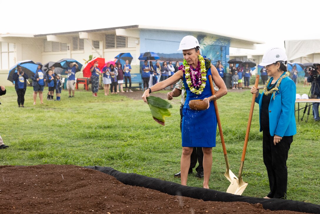 Paloma Almanza, principal of Mokapu Elementary, participates in a Kahu blessing during the Mokapu Elementary groundbreaking ceremony, Marine Corps Base Hawaii, Jan. 4, 2023. The renovation project will transform the existing campus and provide modern facilities designed to serve nearly 1,000 students. (U.S. Marine Corps photo by Cpl. Samantha Sanchez)