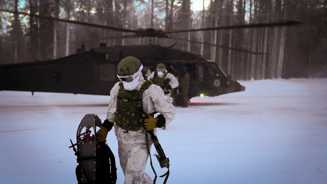 Special Tactics Airmen assigned to 24th Special Operations Wing, Detachment 1, conduct an aerial insertion and field training exercise at Camp Mad Bull training site on Joint Base Elmendorf-Richardson, Alaska, Jan. 10, 2023. The 24 SOW Det 1 Special Tactics Airmen are capable of assessing and opening anything from a major international airport to clandestine dirt strips in either permissive or hostile locations, providing strategic access for follow-on forces during global contingencies, and joint readiness exercises. Alaska Army National Guardsmen assigned to the 207th Aviation Battalion flew UH-60L and HH-60M Black Hawk helicopters in order to support the aerial insertion, medical evacuation and hoist training of the Special Tactics teams. The Alaska Army National Guard’s GSAB routinely trains with all branches of the military as well as civilian agencies to increase its operational interoperability and to be ready for a wide range of federal and state missions.