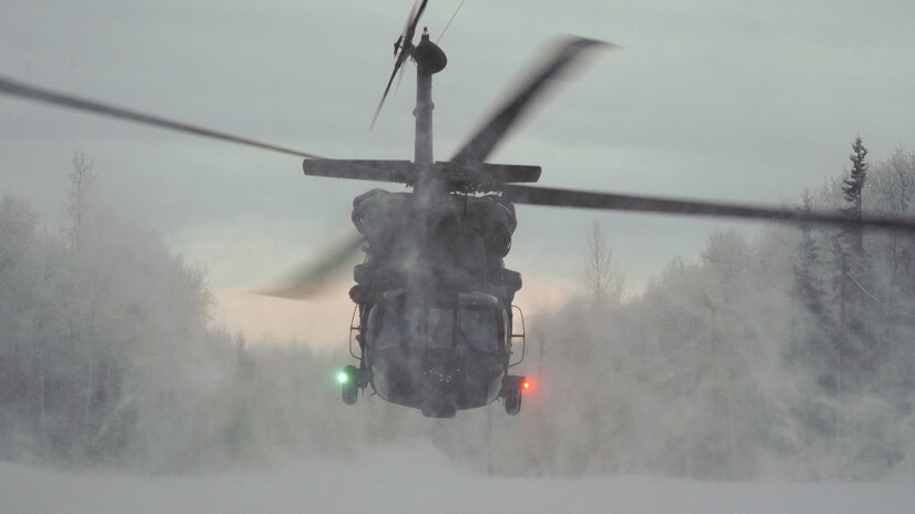 Special Tactics Airmen assigned to 24th Special Operations Wing, Detachment 1, conduct an aerial insertion and field training exercise at Camp Mad Bull training site on Joint Base Elmendorf-Richardson, Alaska, Jan. 10, 2023. The 24 SOW Det 1 Special Tactics Airmen are capable of assessing and opening anything from a major international airport to clandestine dirt strips in either permissive or hostile locations, providing strategic access for follow-on forces during global contingencies, and joint readiness exercises. Alaska Army National Guardsmen assigned to the 207th Aviation Battalion flew UH-60L and HH-60M Black Hawk helicopters in order to support the aerial insertion, medical evacuation and hoist training of the Special Tactics teams. The Alaska Army National Guard’s GSAB routinely trains with all branches of the military as well as civilian agencies to increase its operational interoperability and to be ready for a wide range of federal and state missions.