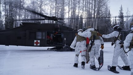 Special Tactics Airmen assigned to 24th Special Operations Wing, Detachment 1, conduct an aerial insertion and field training exercise at Camp Mad Bull training site on Joint Base Elmendorf-Richardson, Alaska, Jan. 10, 2023. The 24 SOW Det 1 Special Tactics Airmen are capable of assessing and opening anything from a major international airport to clandestine dirt strips in either permissive or hostile locations, providing strategic access for follow-on forces during global contingencies, and joint readiness exercises. Alaska Army National Guardsmen assigned to the 207th Aviation Battalion flew UH-60L and HH-60M Black Hawk helicopters in order to support the aerial insertion, medical evacuation and hoist training of the Special Tactics teams. The Alaska Army National Guard’s GSAB routinely trains with all branches of the military as well as civilian agencies to increase its operational interoperability and to be ready for a wide range of federal and state missions.
